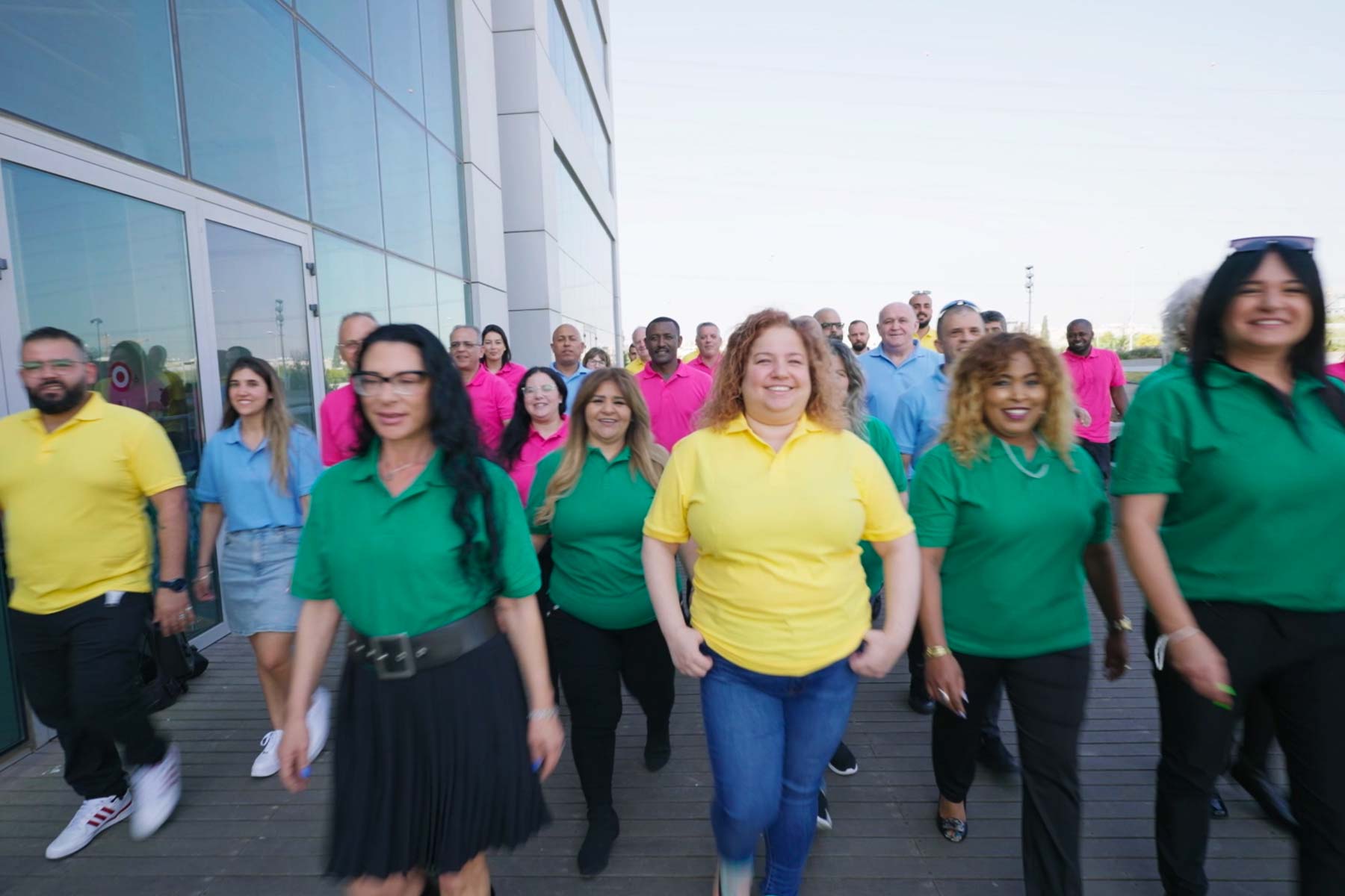Electra FM employees smiling walking together